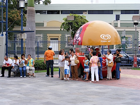The stand is a red and orange globe. 
         The top half lifts up to reveal the vendor.