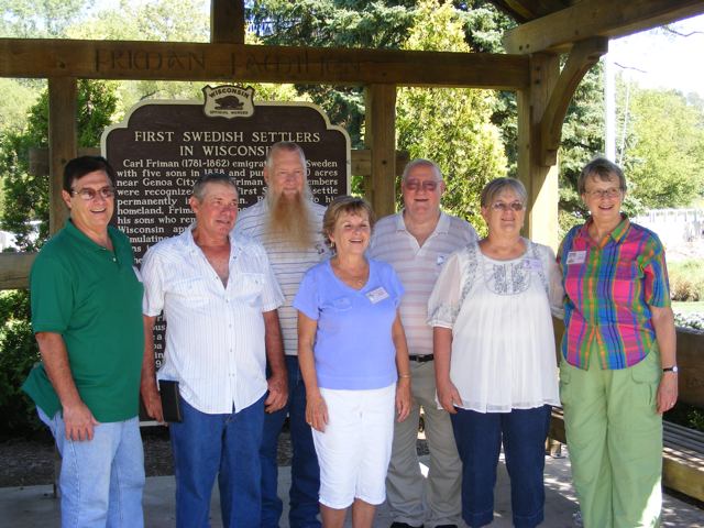 Seven members of the 8th grade class of 1959
               pose in the shelter dedicated to the First Swedish
               Settlers in Wisconsin. Gail is standing on the
               rignt, next to her friend Tina.