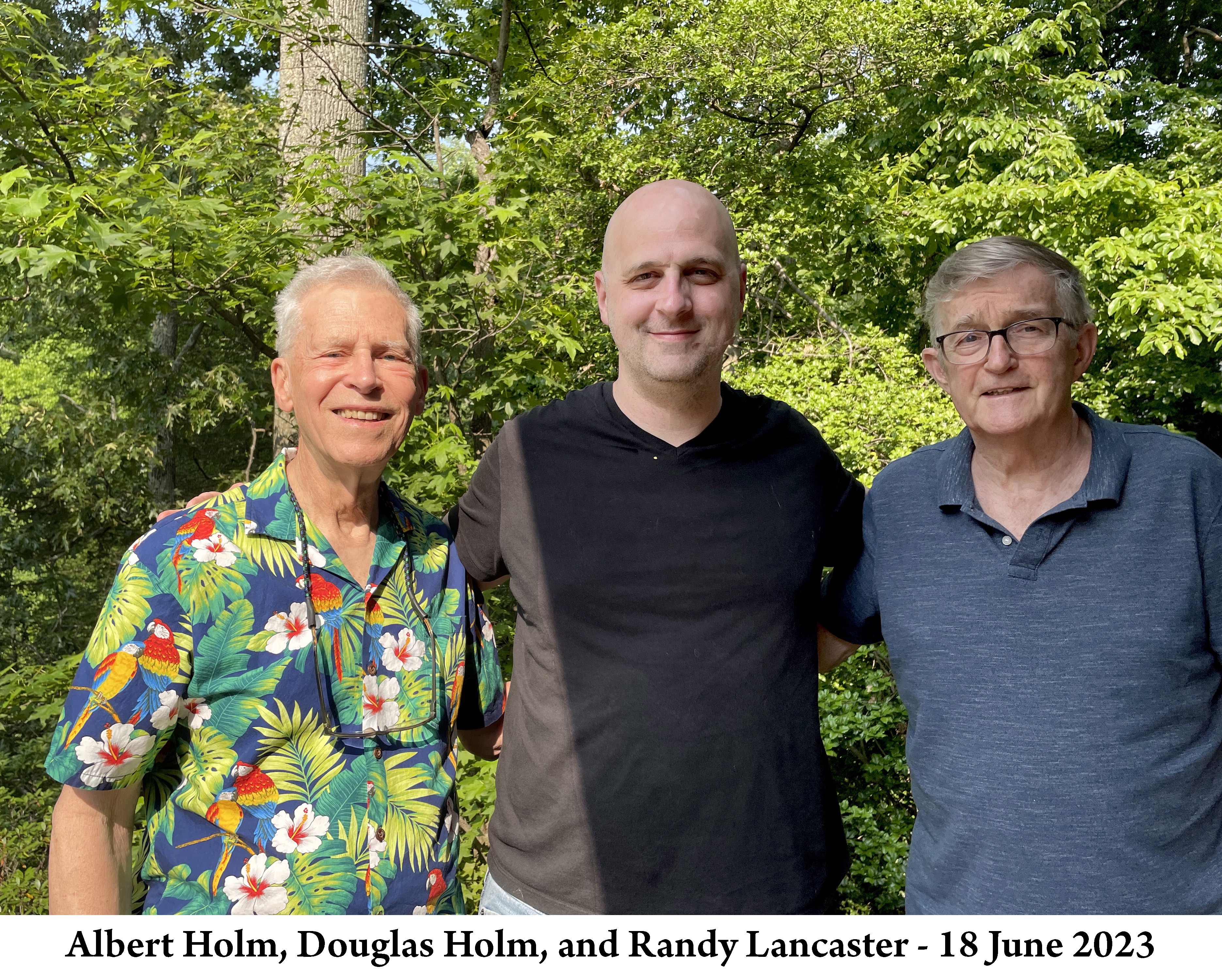 The three of us are standing side-by-side on Lancaster's deck 
               and looking at the camera