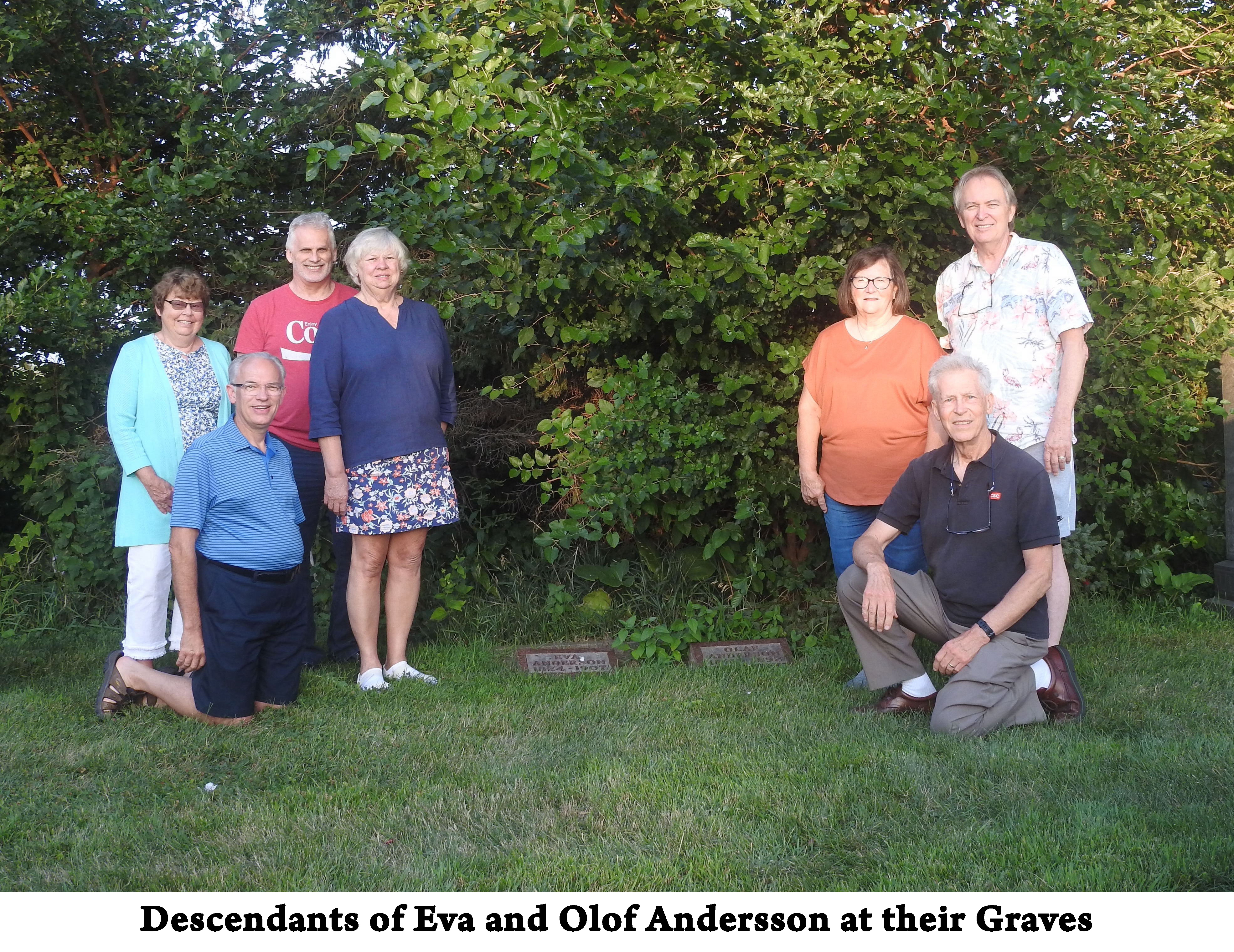 The great-great-grandchildren of Olof and Andersson are on each side
           of their graves 