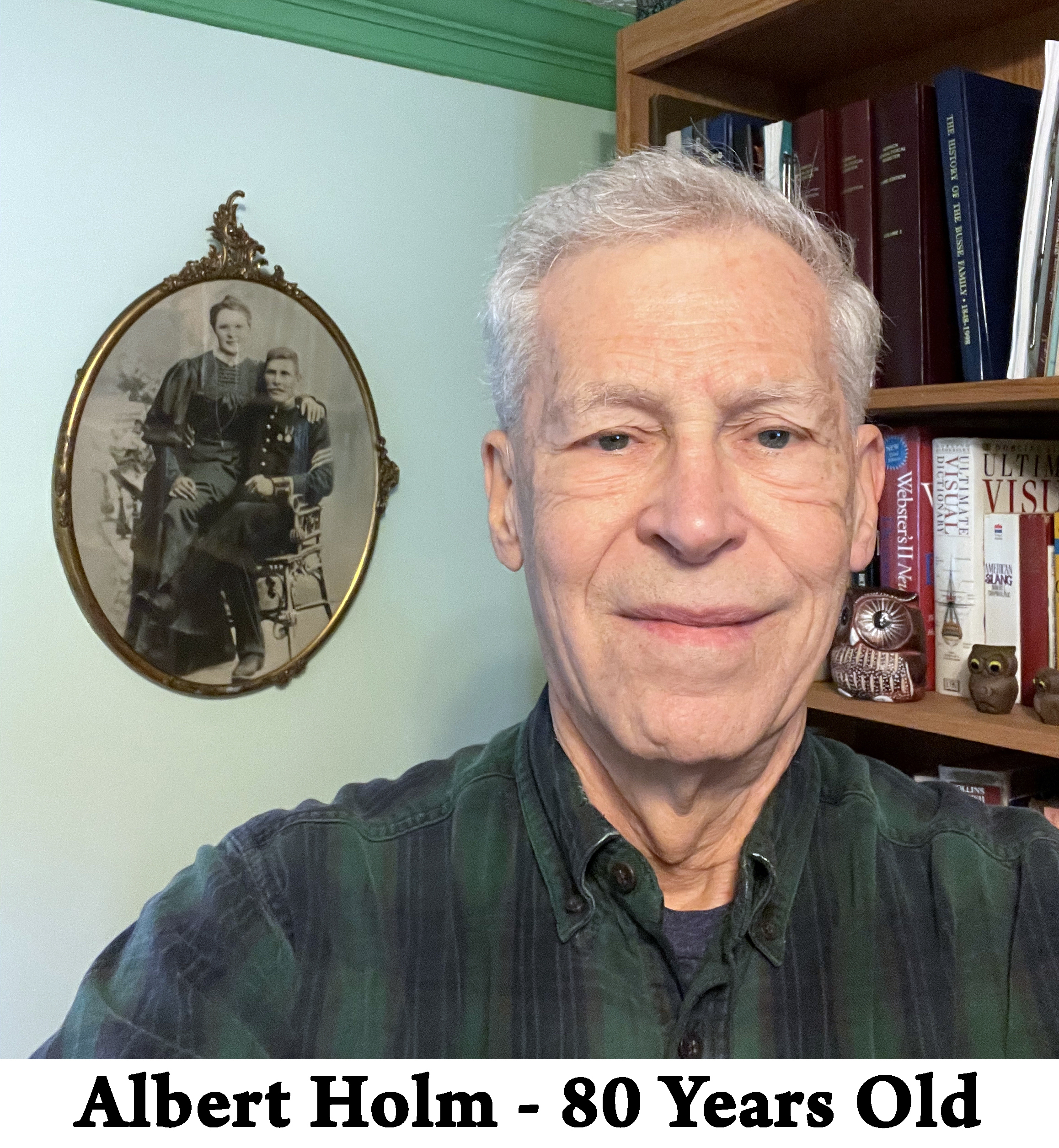 The face of Albert Holm with bookshelves and his grandparent’s wedding 
          photo behind him