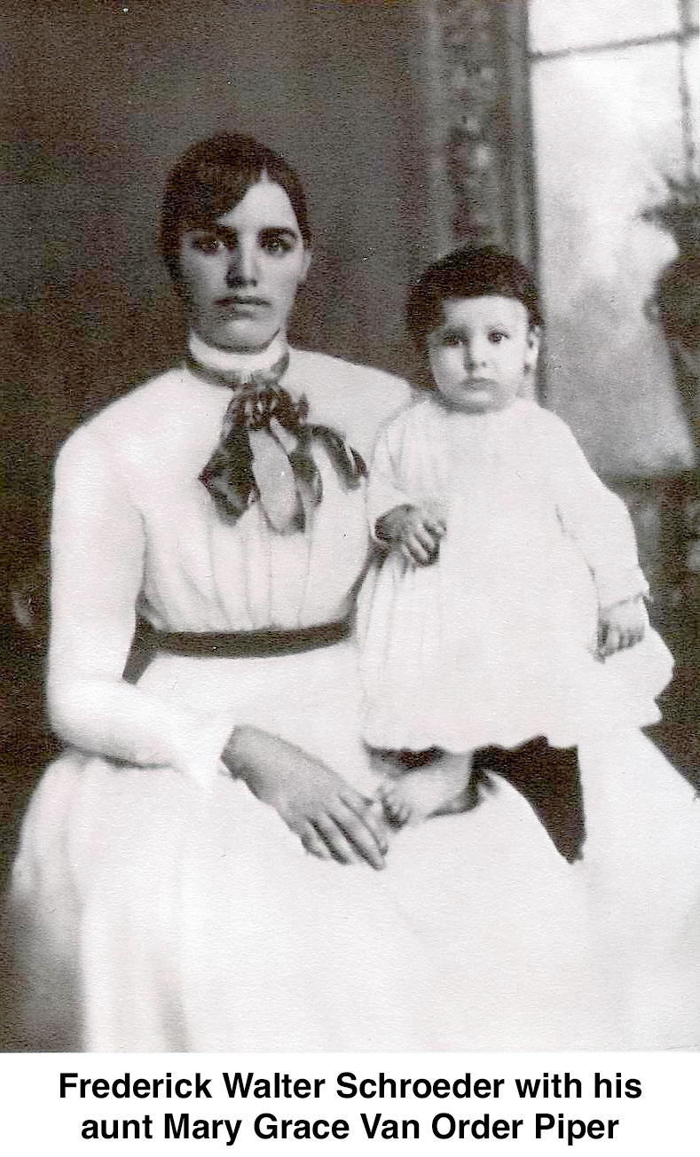 A seated, well-dressed young woman is holding a young child who 
          is wearing a dress, has a full head of  hair, and has bare feet.