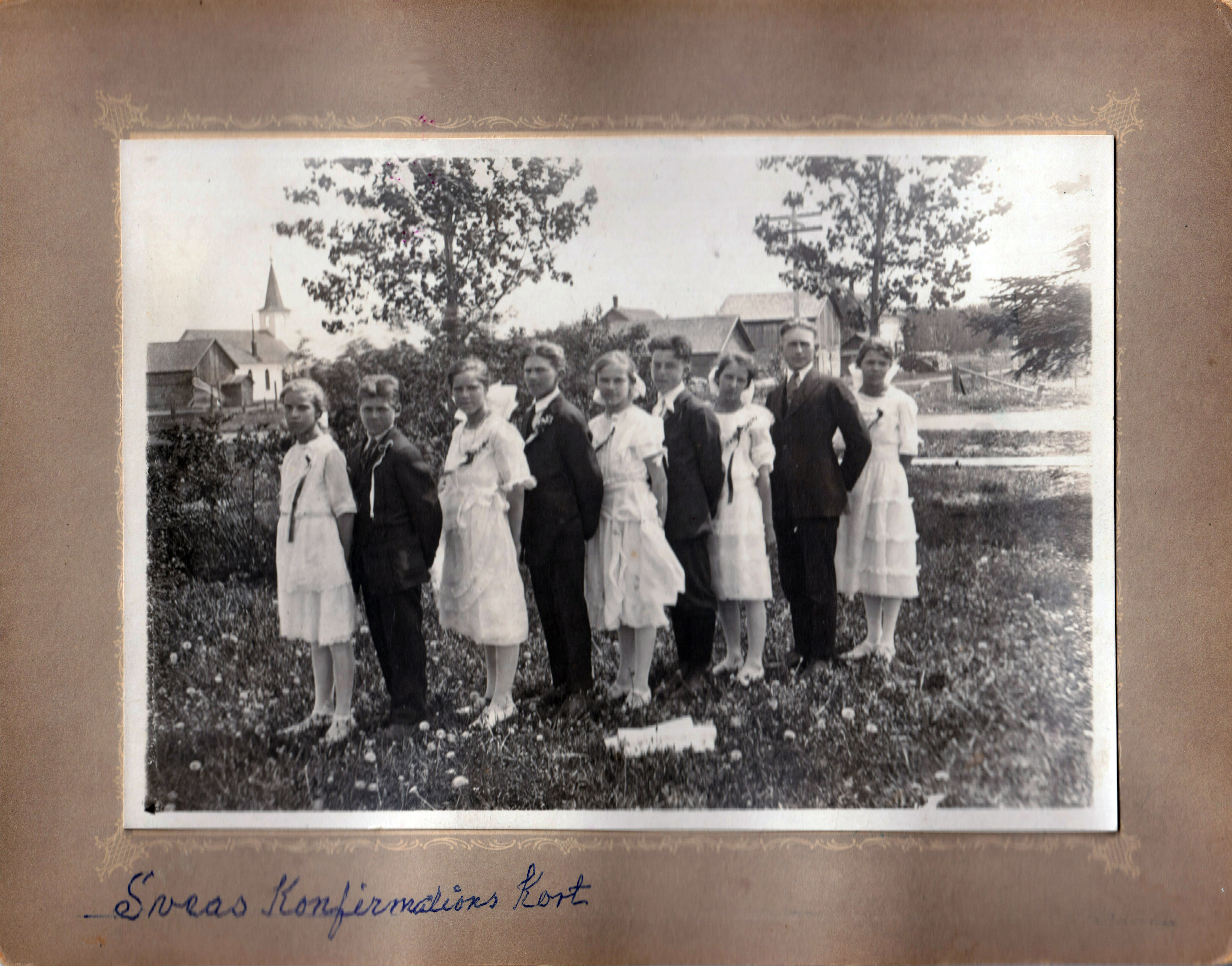 Svea and 8 other members of her confirmation class standing in a field.