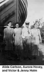 Alida, Aurora, Victor, and Jenny in front of a wooden ship