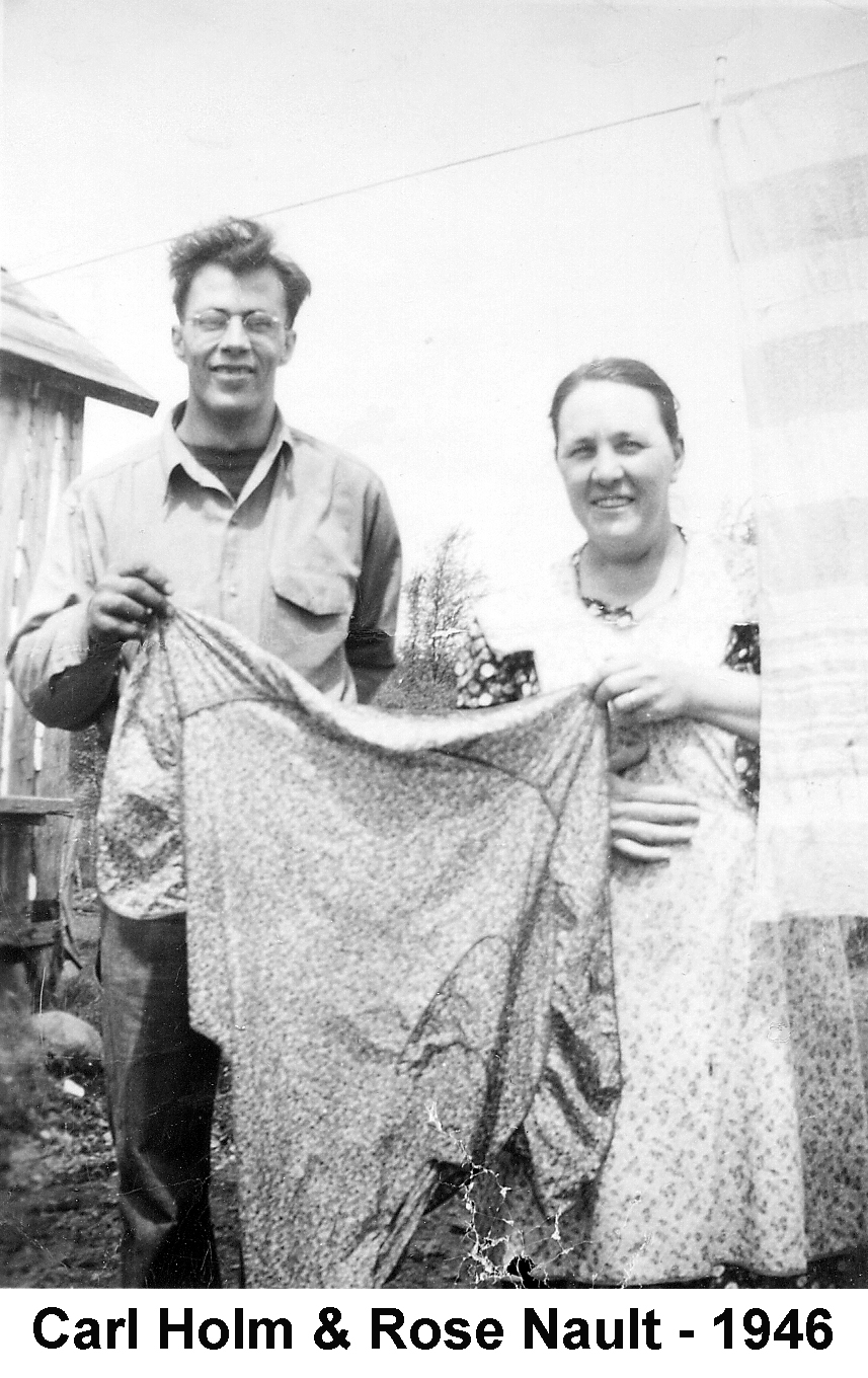 Carl Holm and Rose Nault hang laundry