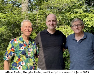 Al Holm, Doug Holm, and Randy Lancaster standing together with trees 
                 in the background on Fathers Day 2023. 