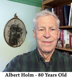 The face of Albert Holm with bookshelves and his grandparent’s wedding 
          photo behind him