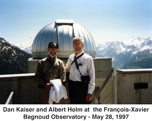We are standing in front of the observatory dome with the snow-capped peaks of the Alps behind us.