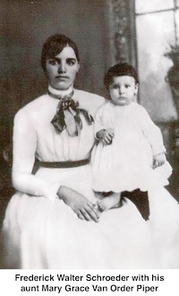 A seated, well-dressed Mary Grace Van Order Piper is holding 
            young Frederick Walter Schroeder, who 
          is wearing a dress, has a full head of  hair, and has bare feet.