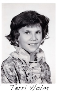 A black-and-white school photo of Terri Holm
