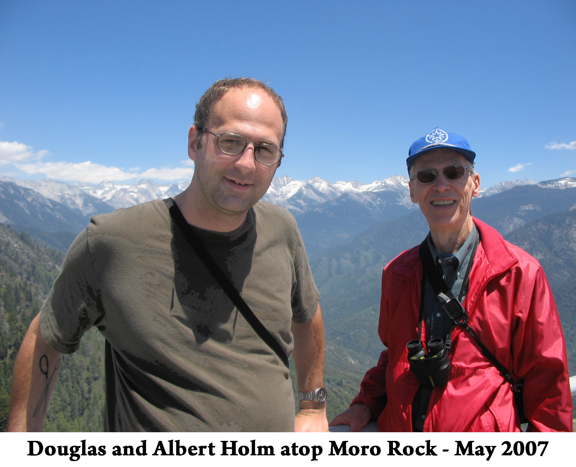 Douglas and Albert are seen against a backdrop of snow-capped 
               Sierra Nevada mountains