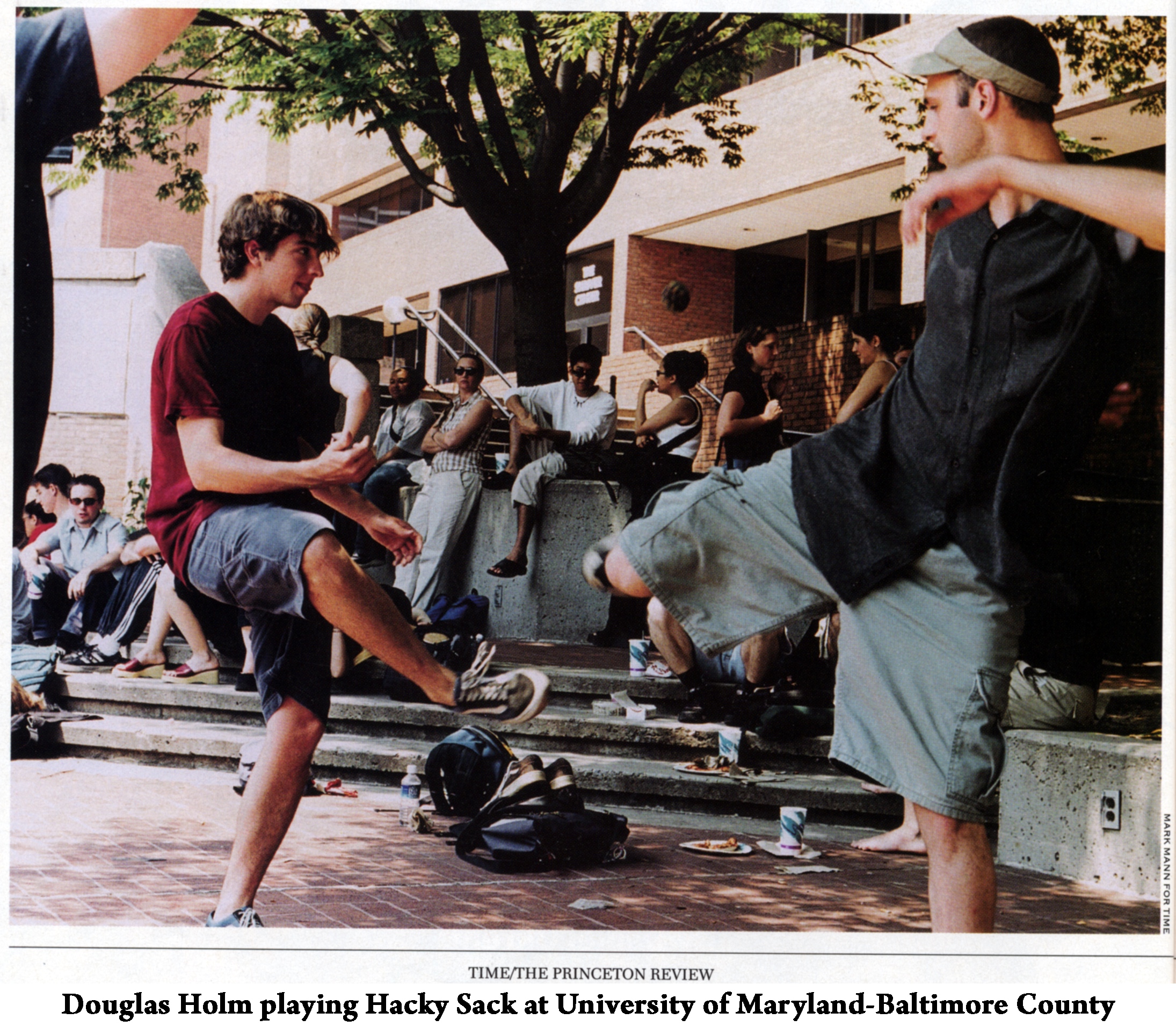 Doug Holm playing hacky sack with another student at UMBC