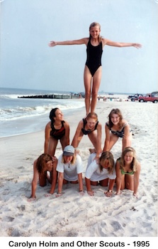 Carolyn is on the bottom left of a three level pyramid on the beach