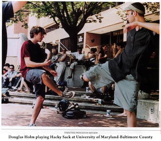 Doug Holm playing hacky sack with another student at UMBC