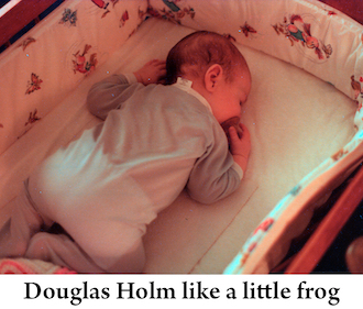 Infant Douglas Holm sleeping on his belly in 