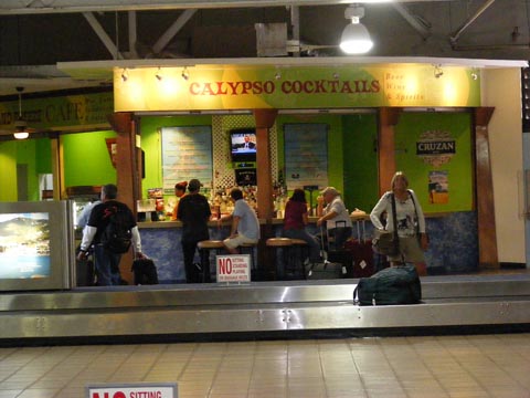 A bar is located adjacent to the luggage carrousel in the airport on St. Thomas.