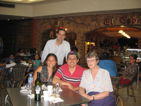 Gail with students in the restaurant