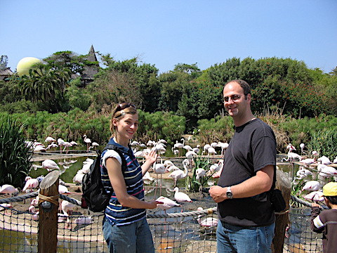 CJ and Doug in front of an exhibit with many flamingos
