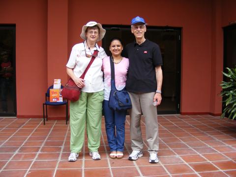 Gail, Catherina, and Al standing in front                of the little museum at the site