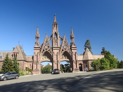 The entrance has to arches with tall, ornate stone towers