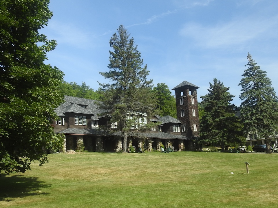 A large, dark building with a tower at one corner.