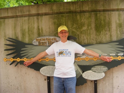 Al stretches his arms in front of a
               representation of the different wingspans.
               His arm reach matches the wingspan of a 
               vulture.
