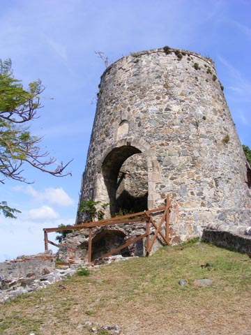 The old windmill was built of
           stone. A wooden upper level and sails have fallen apart.