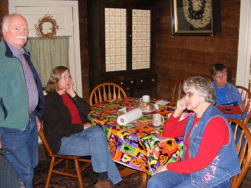 Bob, Ann, Kathy, and Maija around the table in the main room of the Wilkins Mill Guesthouse
