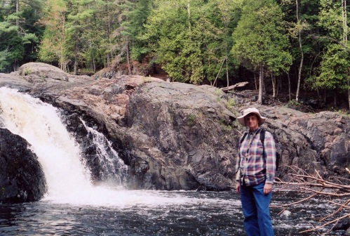 Gail in front ofone of the water falls on the Dead River in Marquette
