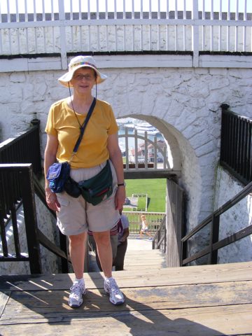 Gail stands at the southern gate through
               the stone wall of the fort. A little of 
               Marquette Park is visible 150 feet below.