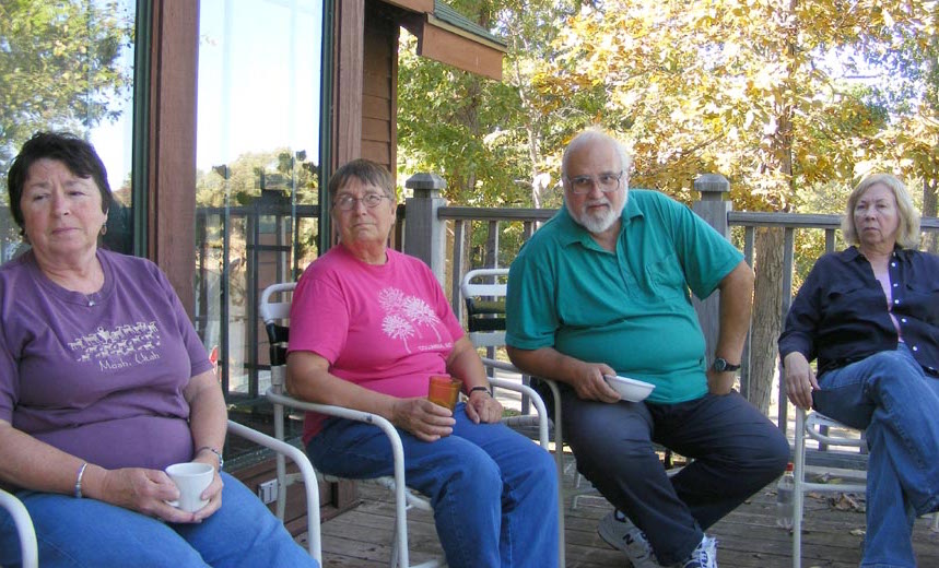 Lolly, Maija, Bob and Ann sitting on the deck