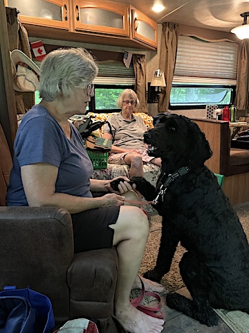 Terri is talking to Teddy after he excitedly ran back and forth in the 
                RV and jumped on our bed. 